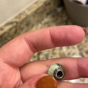 Green and white pandora bead
